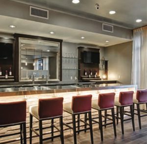 Restaurant bar with upholstered chair stools
