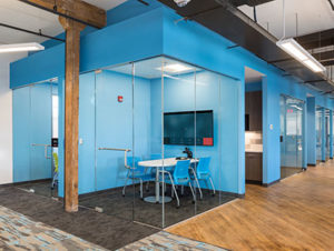 Office interior with bright blue walls
