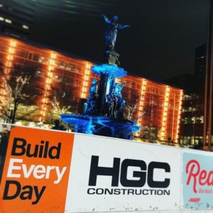 Fountain Square statue with HGC sign in foreground