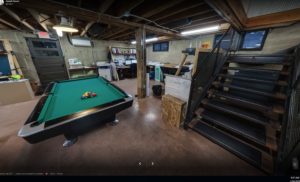 Basement office with pool table.