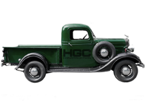 A pick-up truck from the 1930s, painted green and bearing the HGC Construction logo in black.