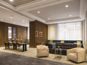 Hotel lobby with dark wood and luxurious seating