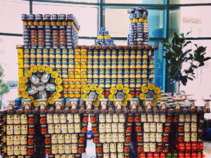 Train sculpture made of canned goods