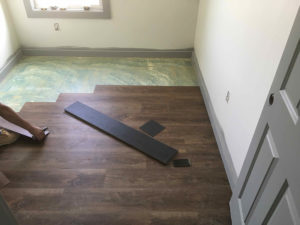 New laminate flooring for Delta Chi house