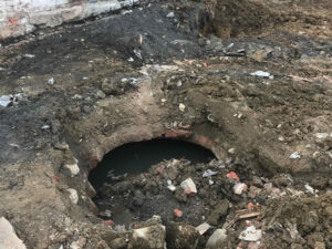 hand laid cistern discovered at job site