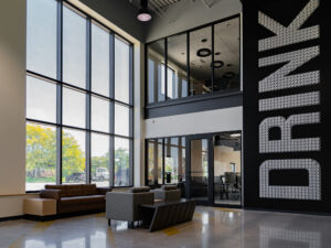 grand atrium at Stagnaro Distributing, with custom wall art made from beer cans